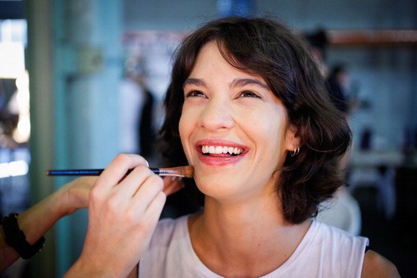 woman doing makeup
