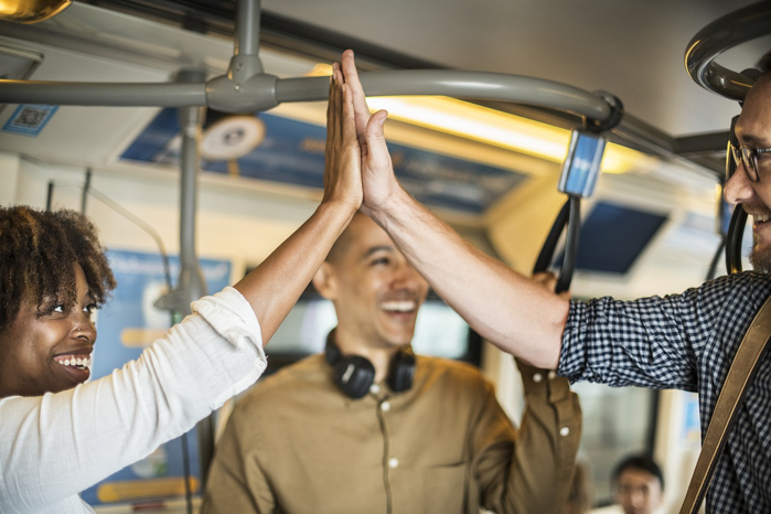 high fives on the subway